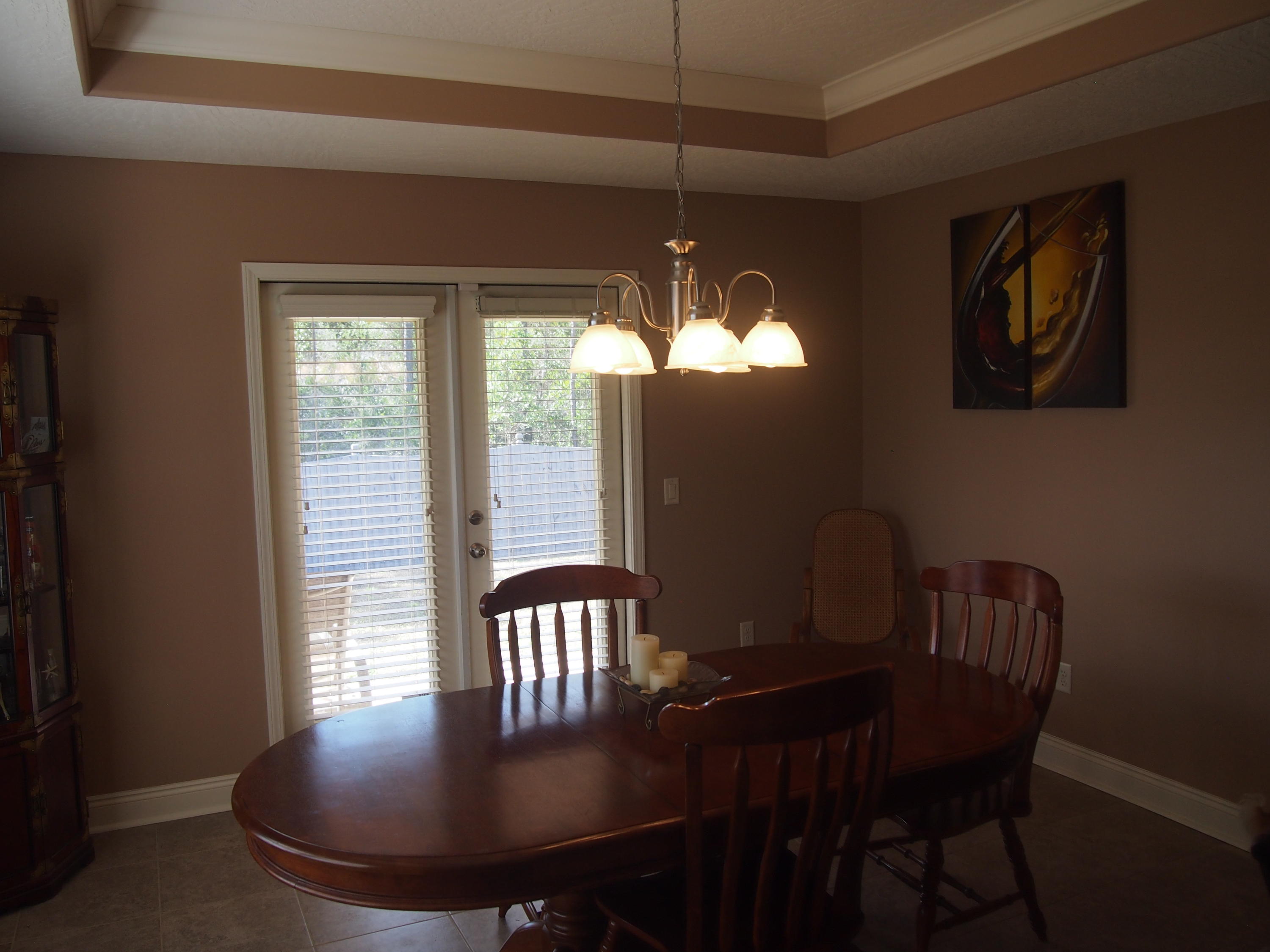 9273 Sundance Court Navarre, FL 32566 - Photo 16 of 33 a view of a dining room with furniture and window