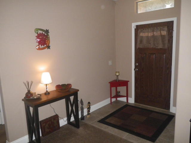 9273 Sundance Court Navarre, FL 32566 - Photo 2 of 33 a room with furniture and a window