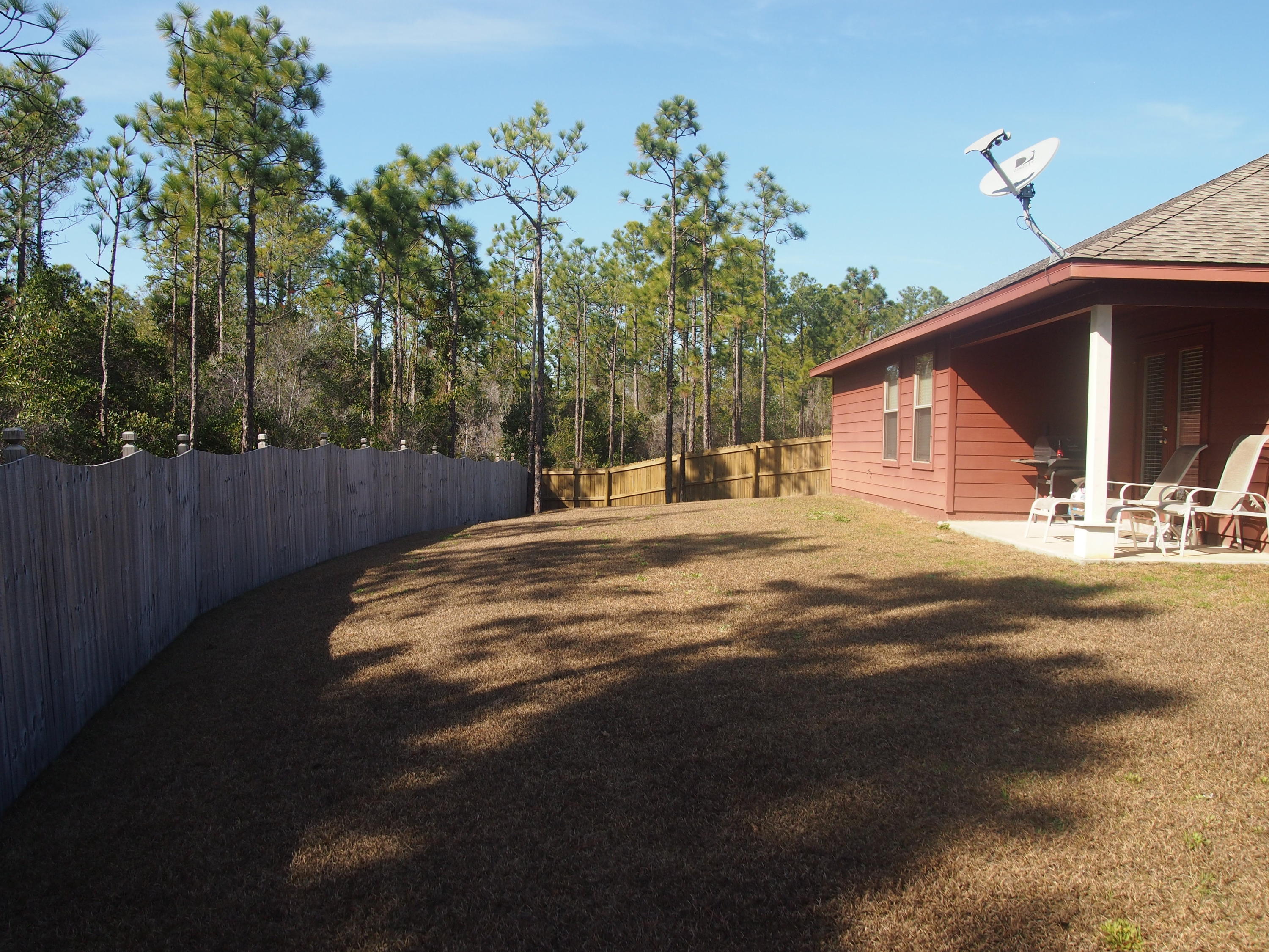 9273 Sundance Court Navarre, FL 32566 - Photo 30 of 33 a house view with a outdoor space