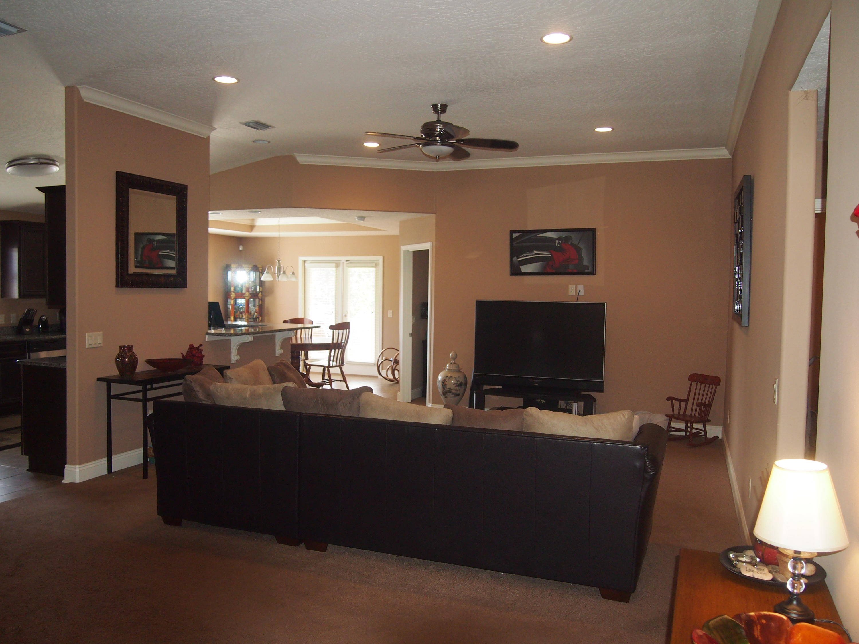 9273 Sundance Court Navarre, FL 32566 - Photo 3 of 33 a living room with furniture and a flat screen tv