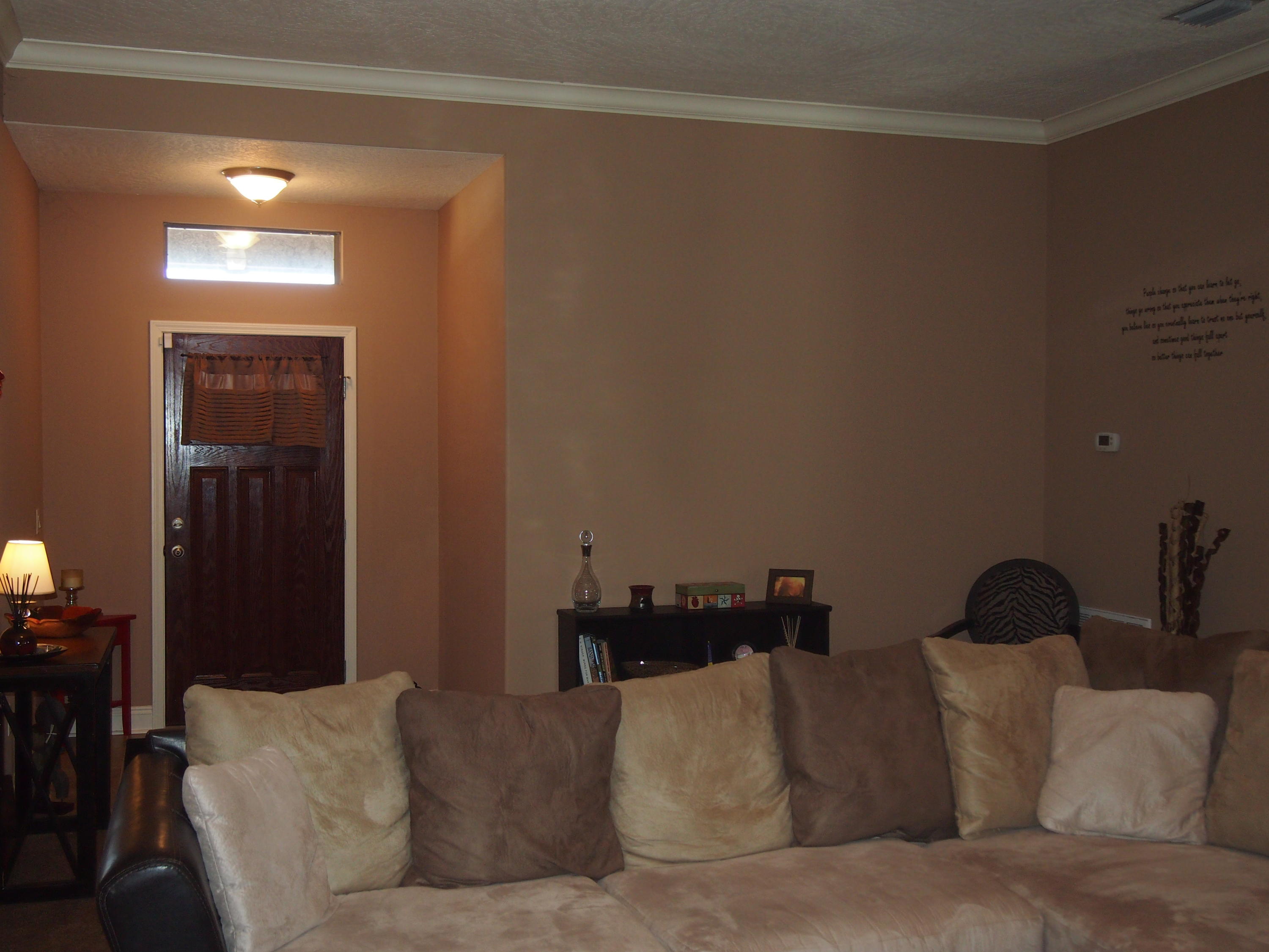 9273 Sundance Court Navarre, FL 32566 - Photo 4 of 33 a living room with furniture and a lamp