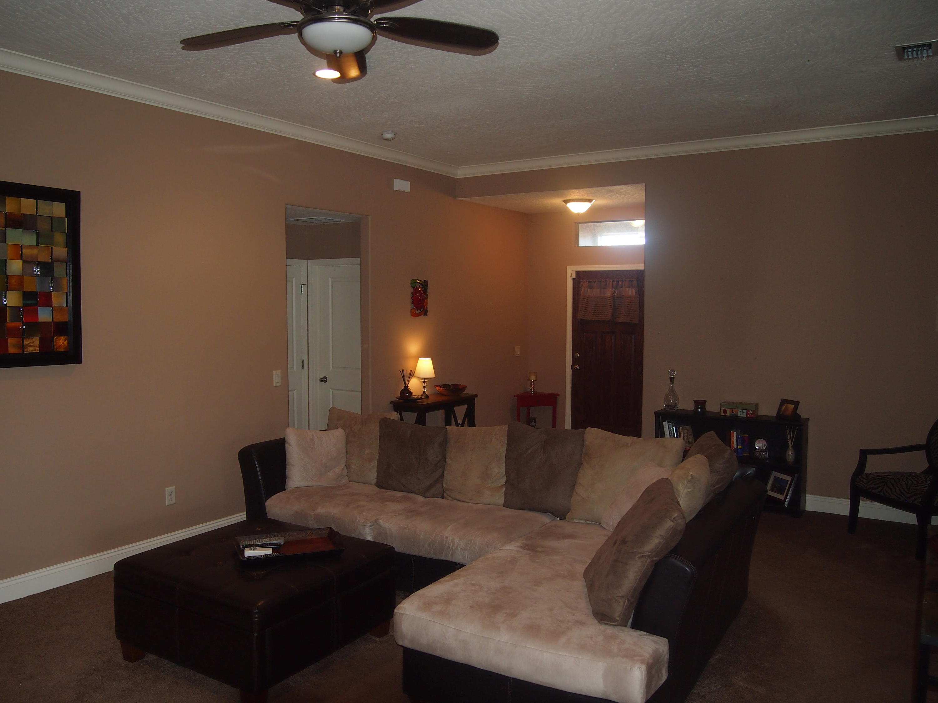 9273 Sundance Court Navarre, FL 32566 - Photo 5 of 33 a living room with furniture and a ceiling fan