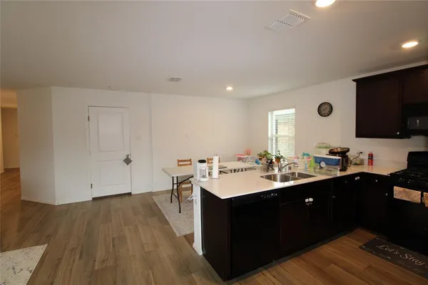 a kitchen with a sink and cabinets