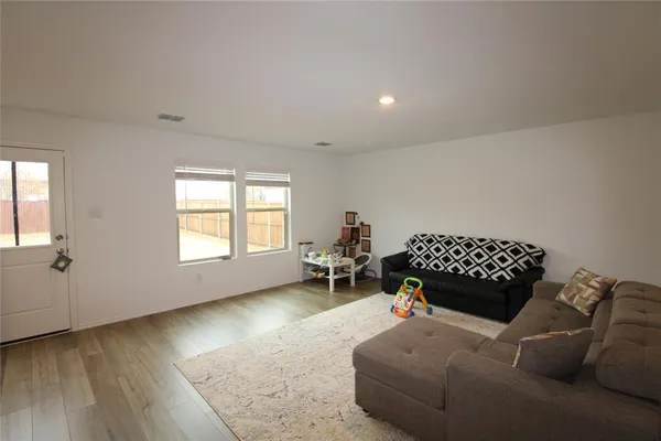 a living room with a couch and a window