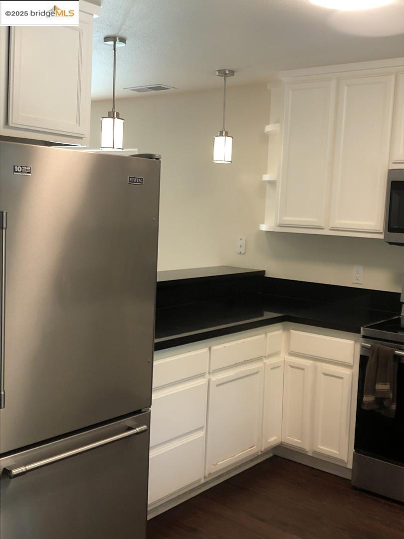 4088 Hackberry Place Davis, CA 95618 - Photo 24 of 58 a kitchen with a sink and white cabinets
