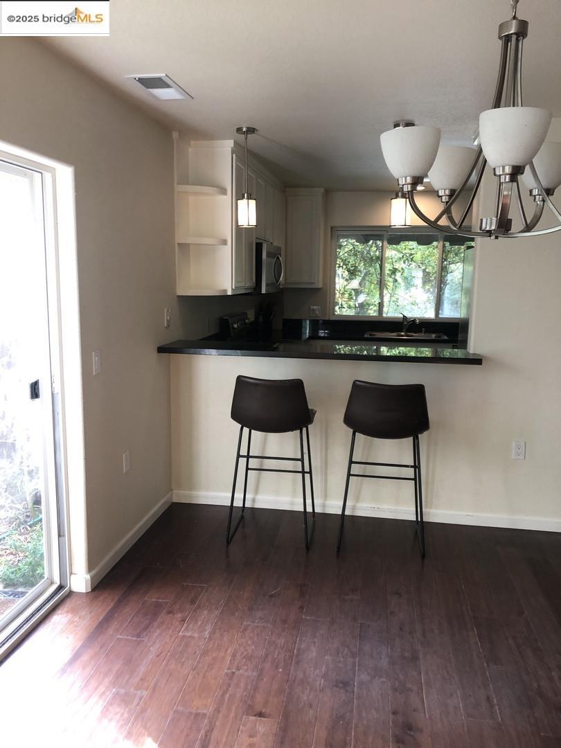 4088 Hackberry Place Davis, CA 95618 - Photo 26 of 58 a view of a room with a window and wooden floor