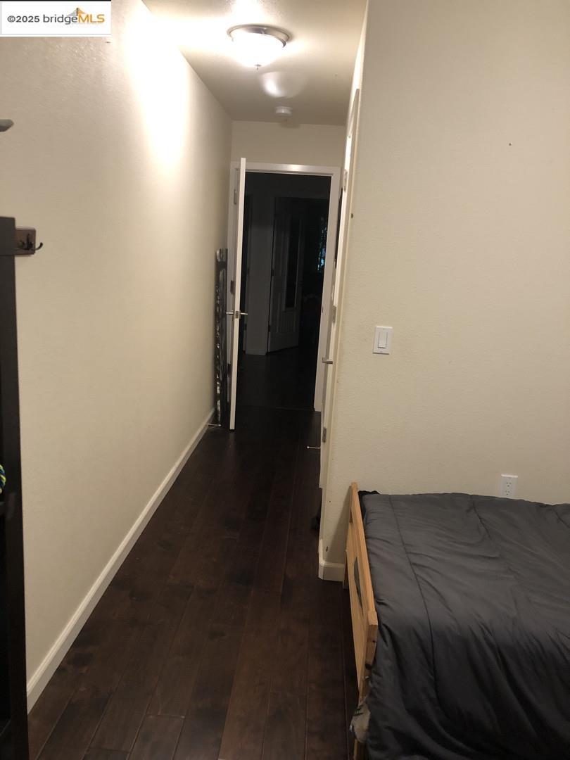 4088 Hackberry Place Davis, CA 95618 - Photo 43 of 58 a view of a hallway with wooden floor