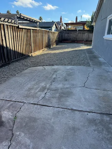 a view of a patio with a yard