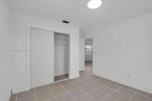 an empty room with a bathroom