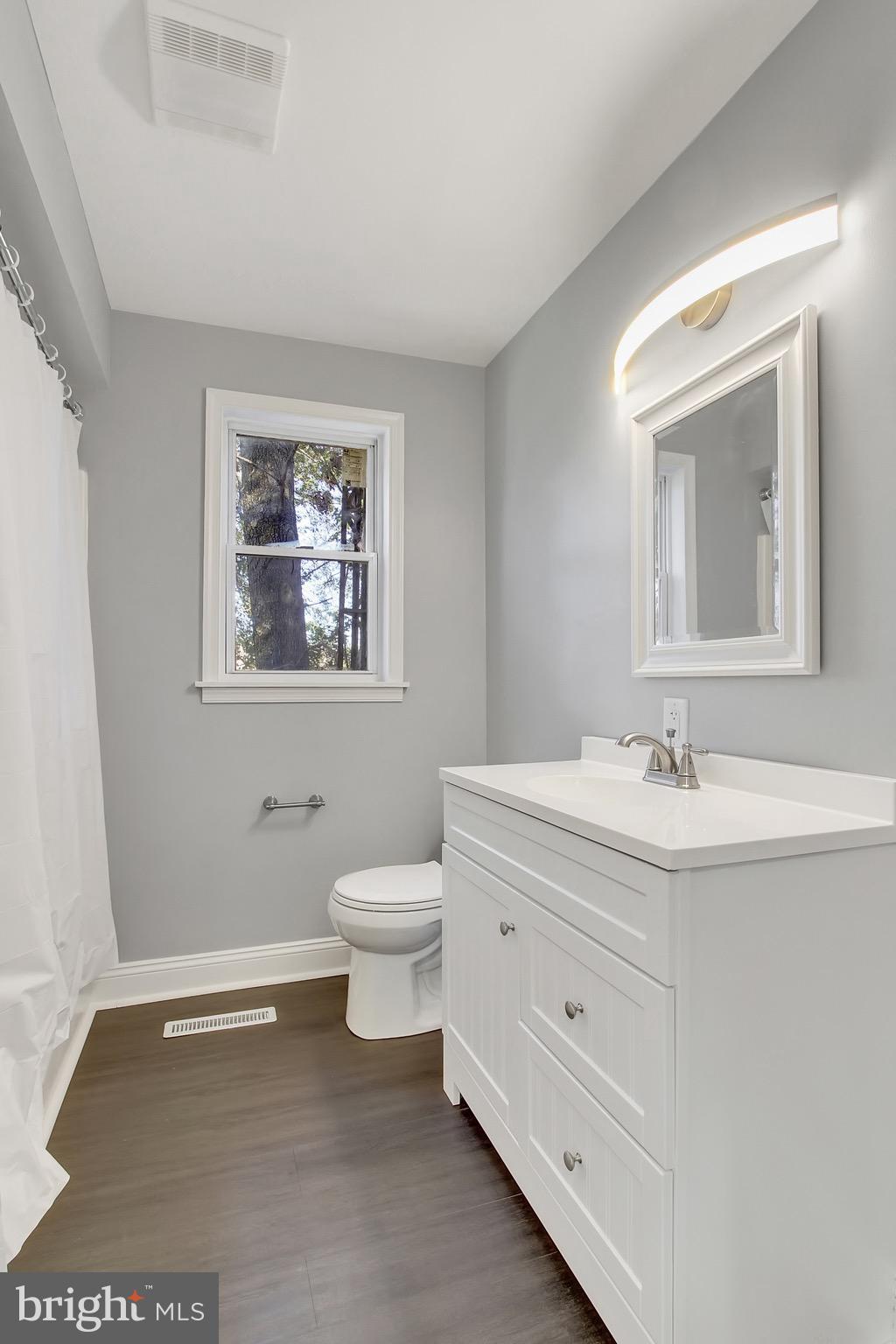 1807 Jug Road Dover, PA 17315 - Photo 17 of 27 a bathroom with a toilet sink and mirror