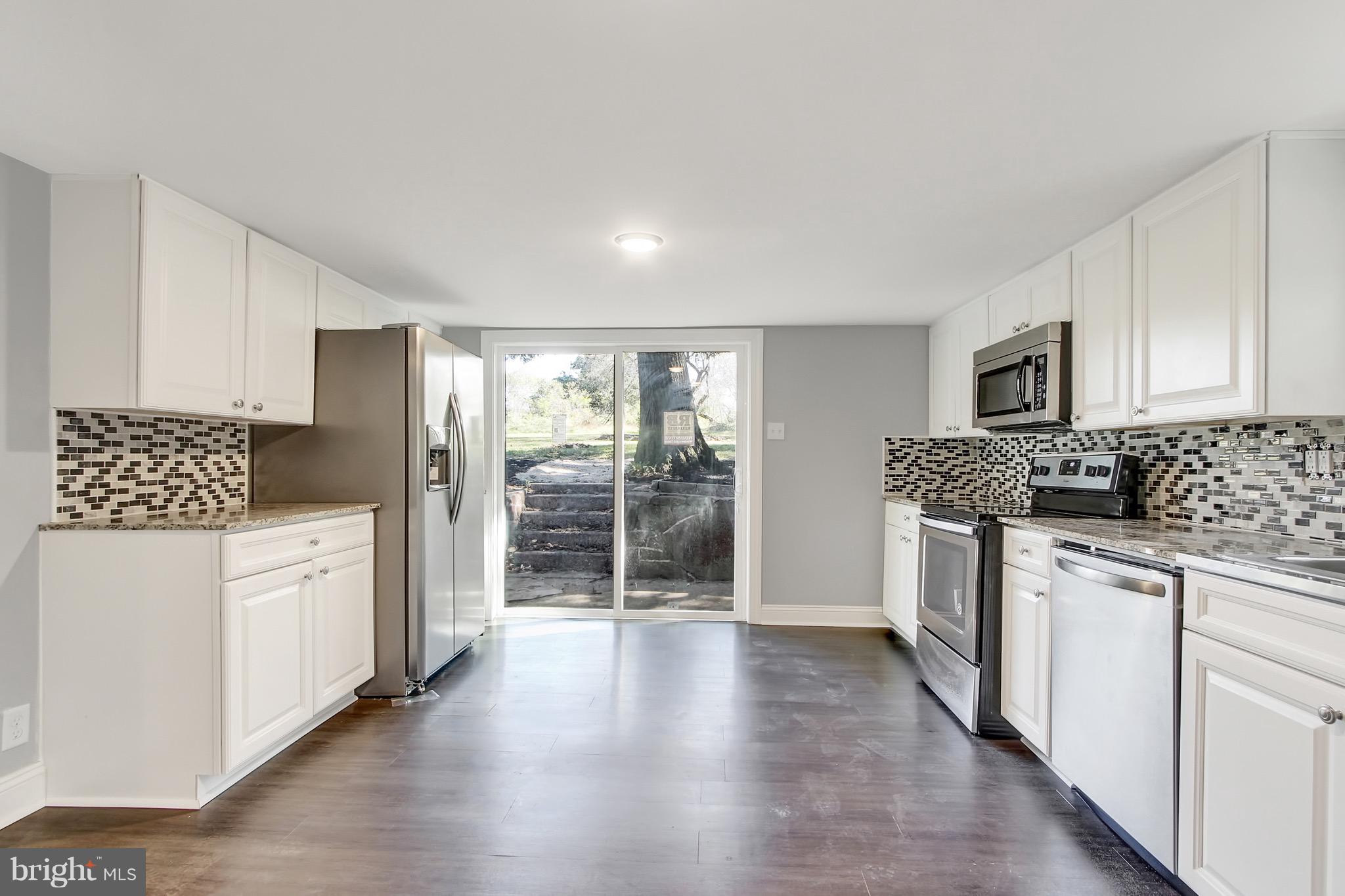 1807 Jug Road Dover, PA 17315 - Photo 5 of 27 a kitchen with stainless steel appliances a refrigerator sink and cabinets