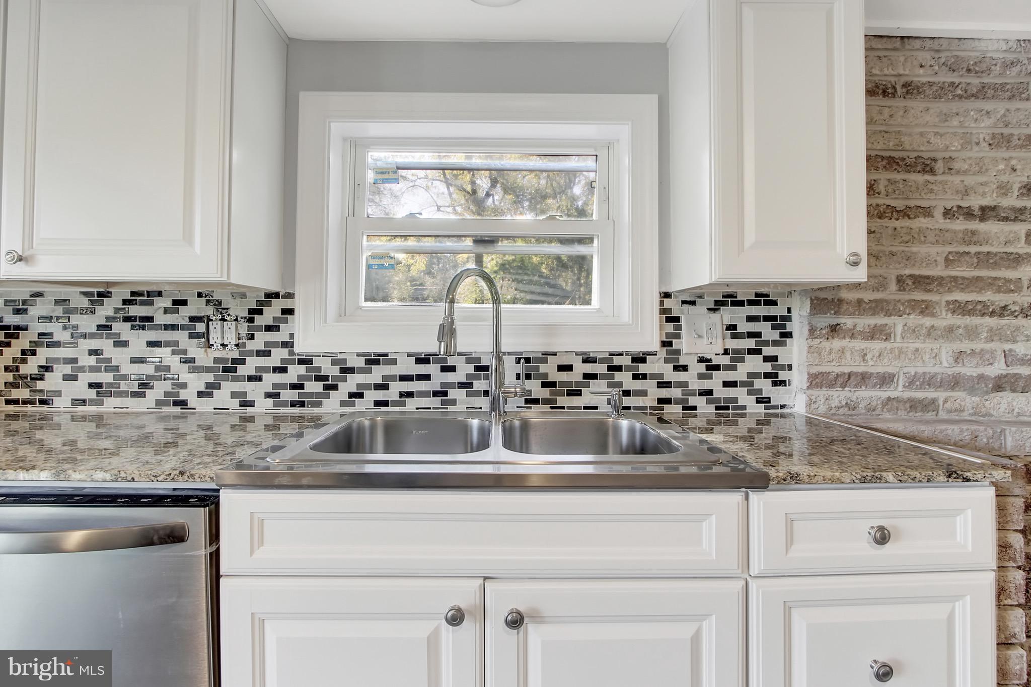 1807 Jug Road Dover, PA 17315 - Photo 7 of 27 a kitchen with granite countertop a sink and a window