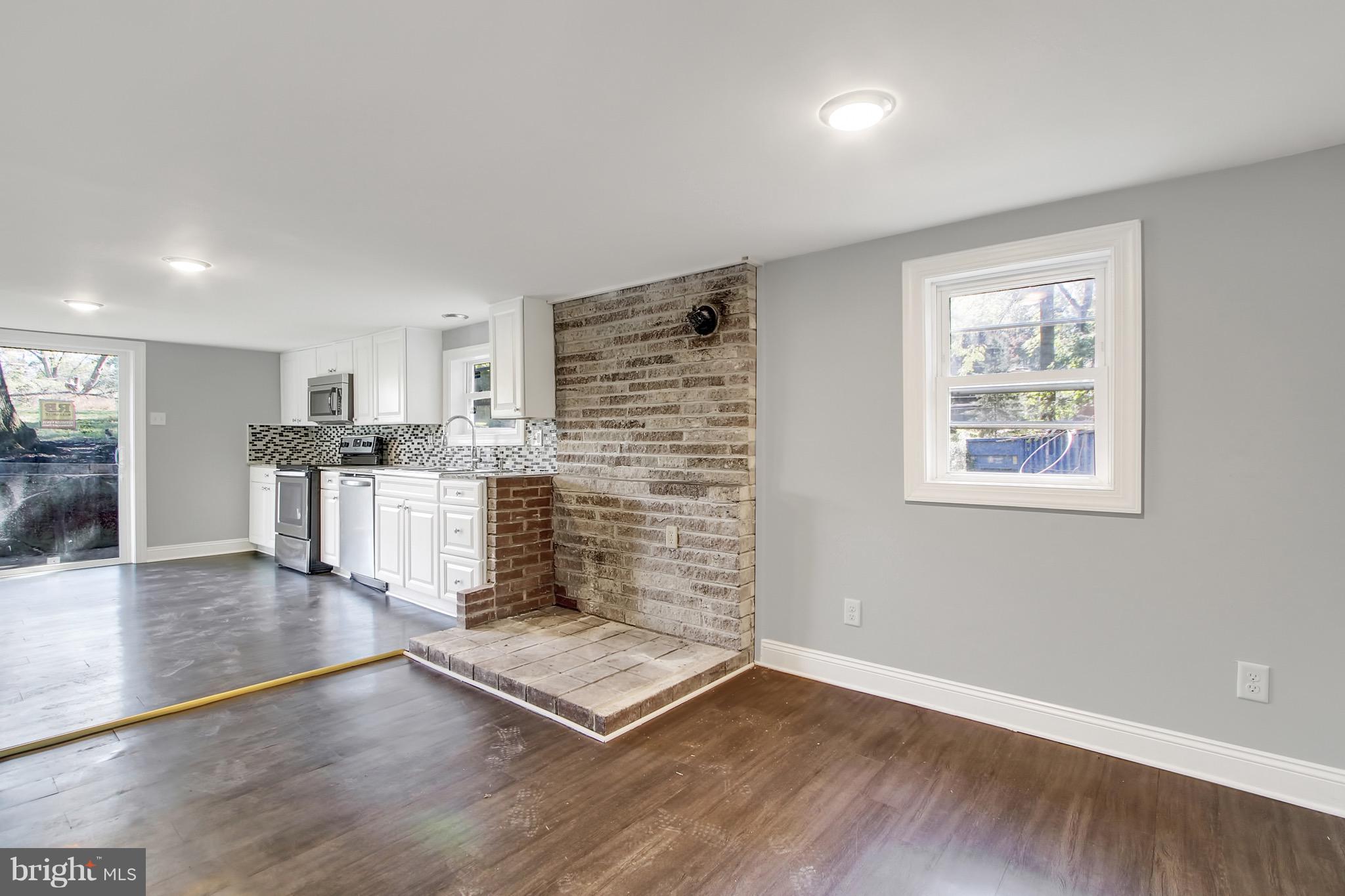 1807 Jug Road Dover, PA 17315 - Photo 9 of 27 a living room with hard wood floors and a kitchen
