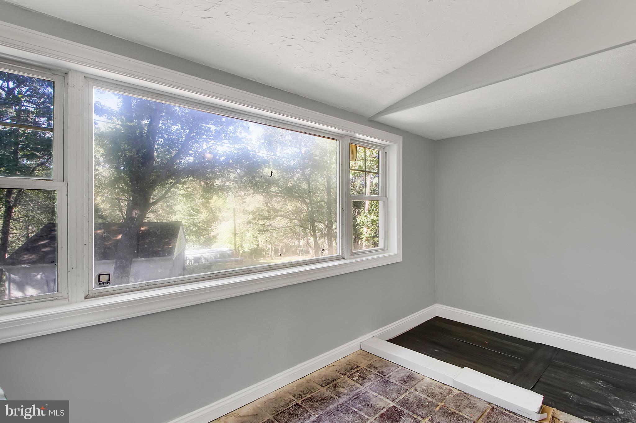 1807 Jug Road Dover, PA 17315 - Photo 10 of 27 a view of empty room with wooden floor and a window