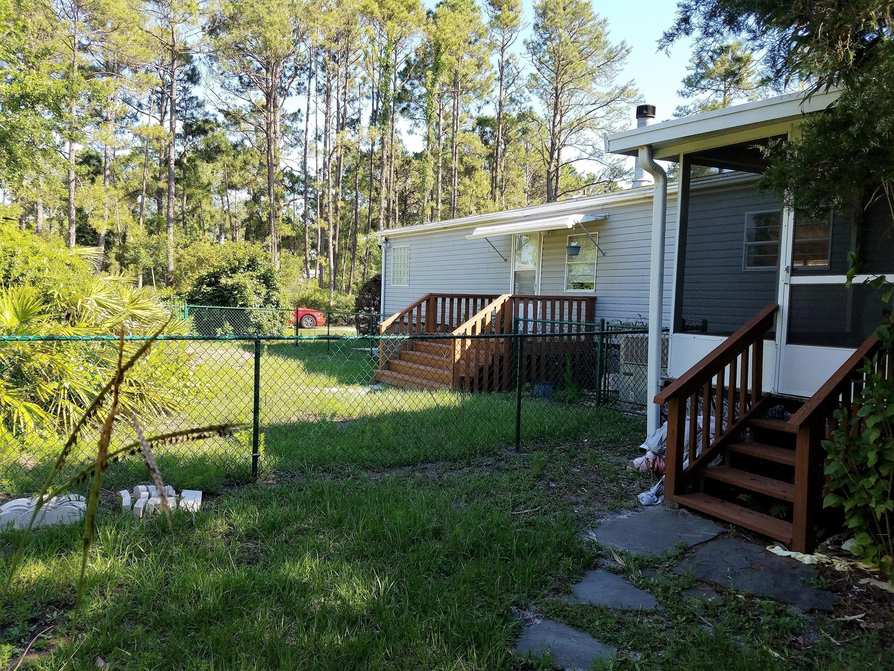 10375 Sawpit Road Jacksonville, FL 32226 - Photo 54 of 55 a view of a house with backyard and garden