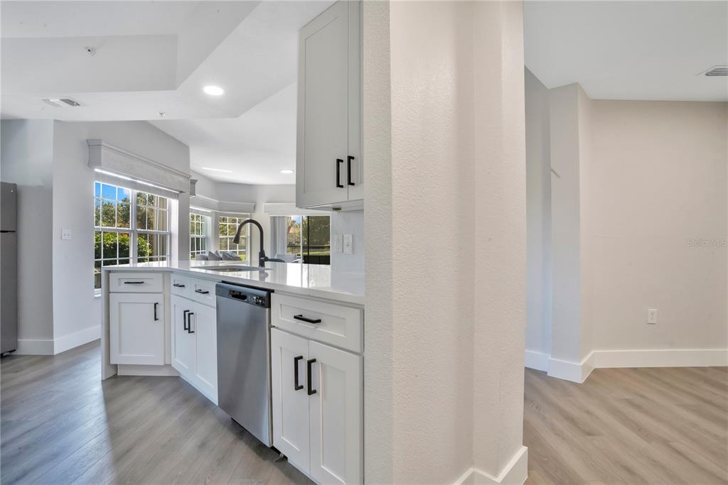 8601 Worldquest Boulevard, Unit 3108 Orlando, FL 32821 - Photo 6 of 24 a kitchen with appliances a sink and cabinets