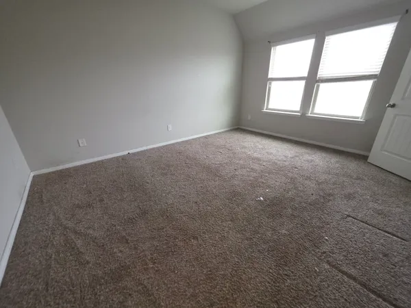 an empty room with a empty space and window