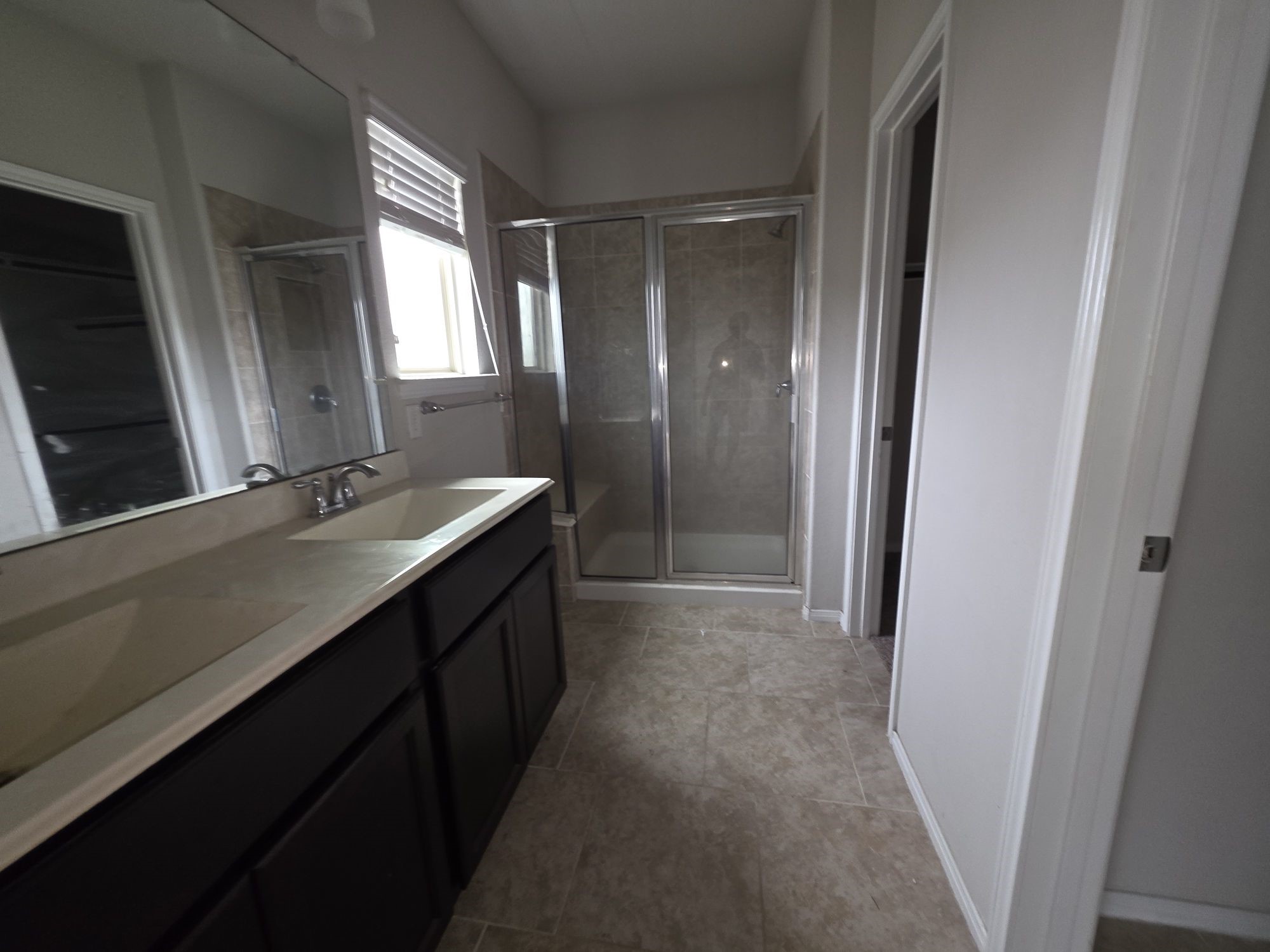 3421 Orch Brg Lane Rosenberg, TX 77471 - Photo 8 of 12 a bathroom with a double vanity sink and a mirror
