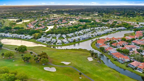 an aerial view of a golf course with parking space