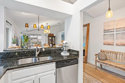 a kitchen with sink and window