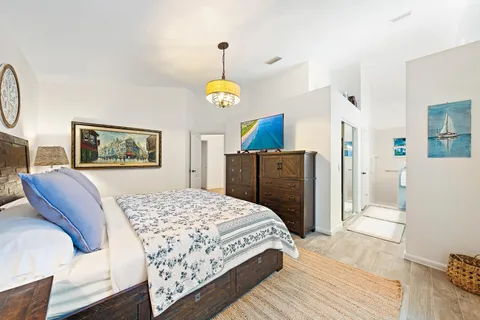 a bedroom with a bed and a dresser
