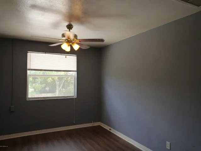 a a chandelier fan and window in the room