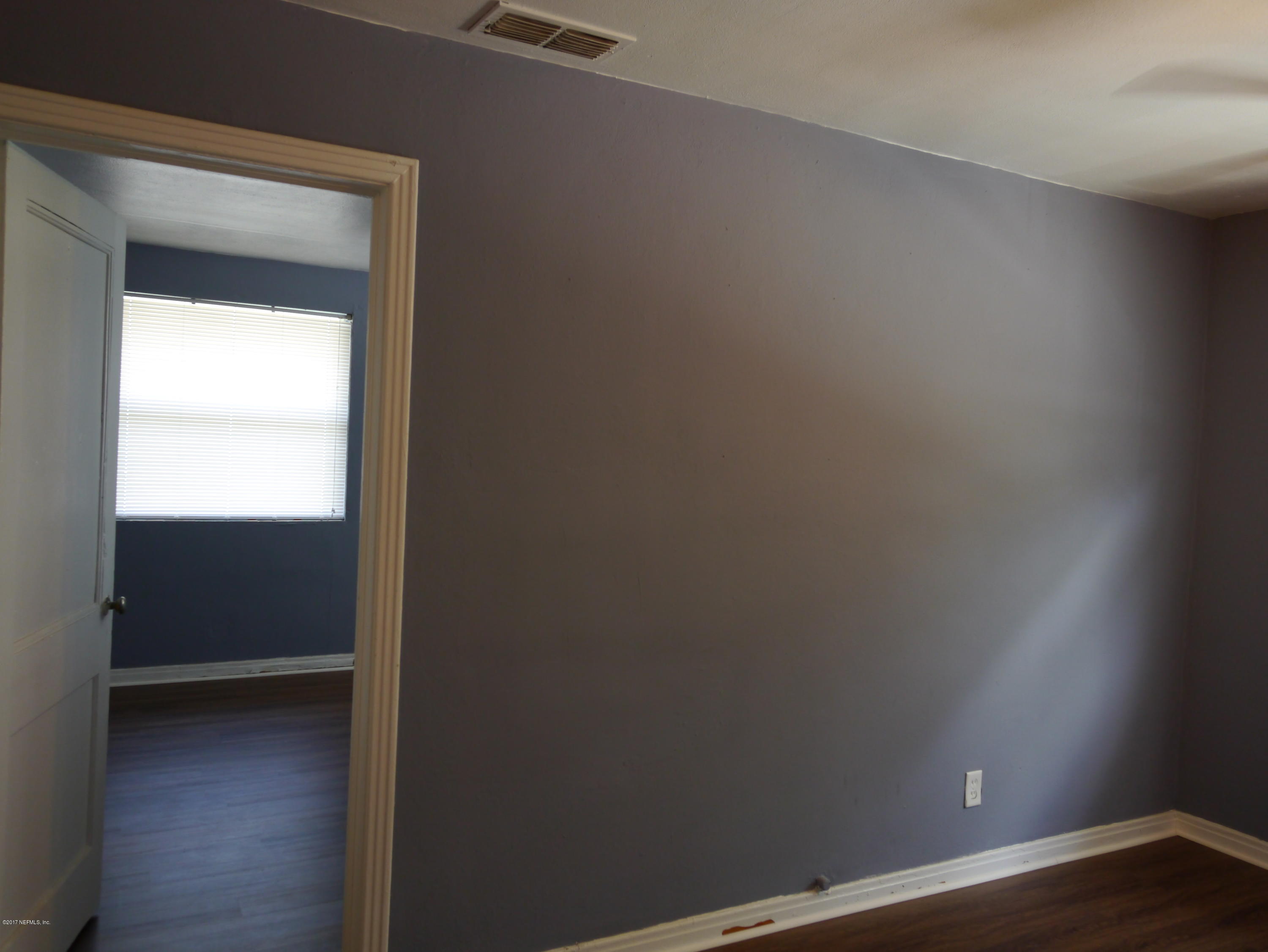 2153 Post Street, Unit 4 Jacksonville, FL 32204 - Photo 7 of 17 a view of an empty room and wooden floor
