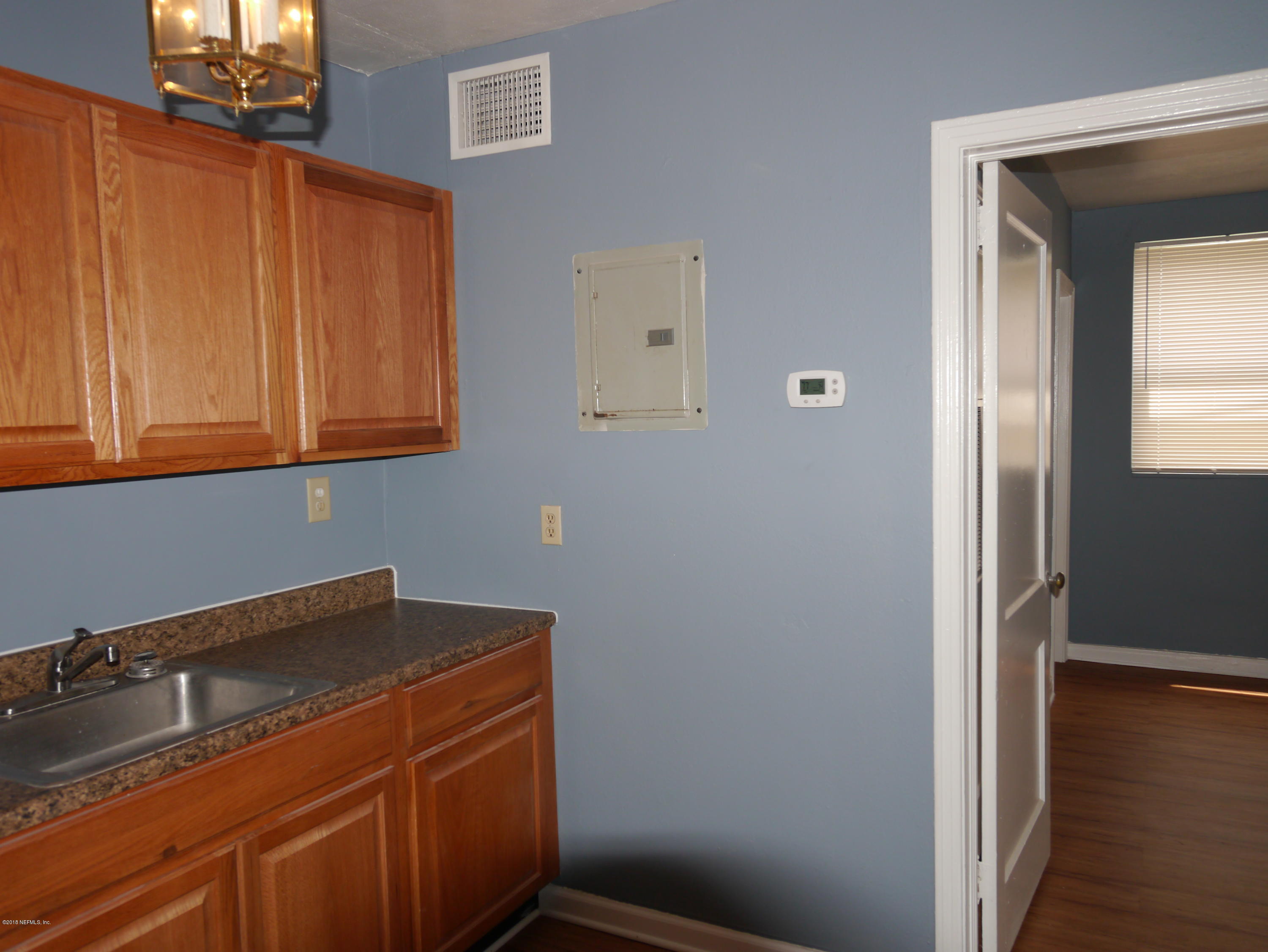 2153 Post Street, Unit 4 Jacksonville, FL 32204 - Photo 9 of 17 a view of storage and utility room with wooden floor