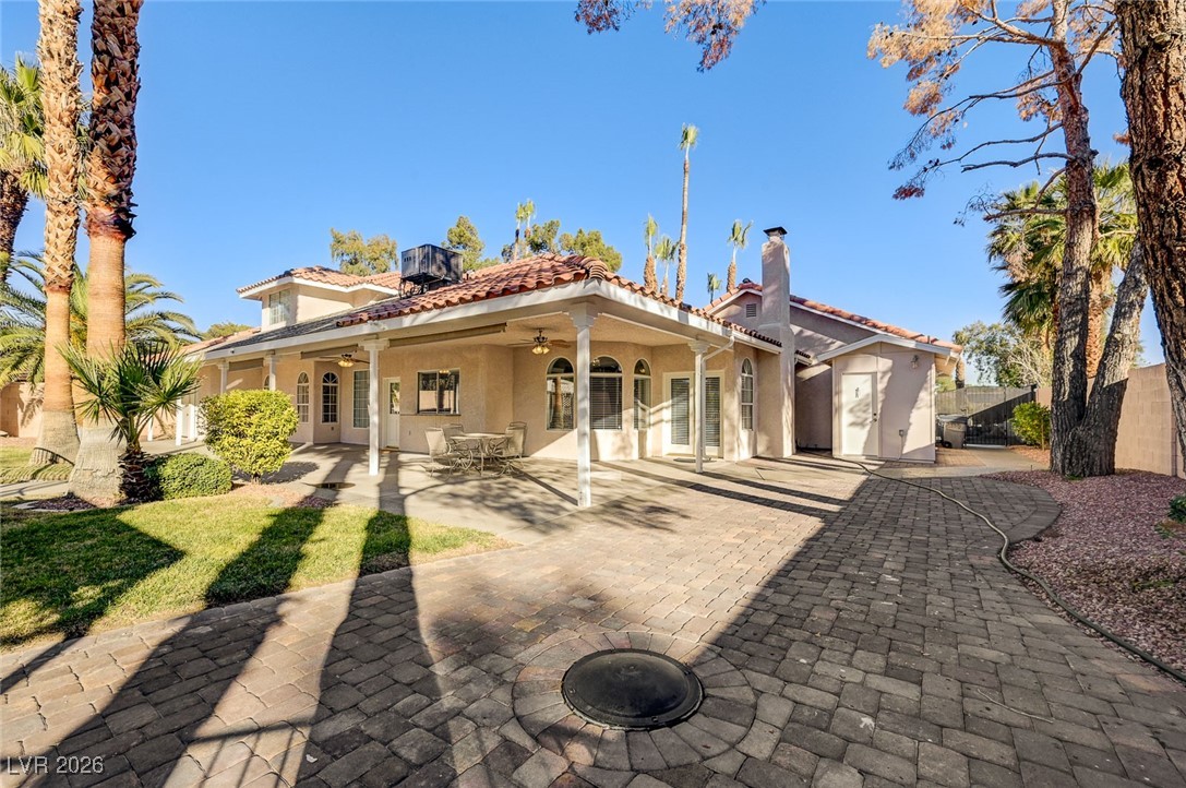 2955 El Camino Road Las Vegas, NV 89146 - Photo 77 of 99 Rear view of property featuring stucco siding, a tiled roof, a patio area, a ceiling fan, and french doors