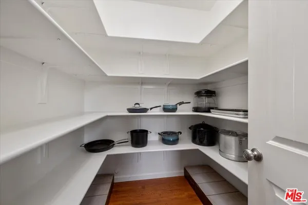 a bathroom with a double vanity sink and mirror