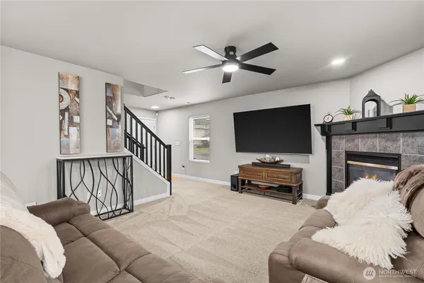 a living room with furniture and a fireplace