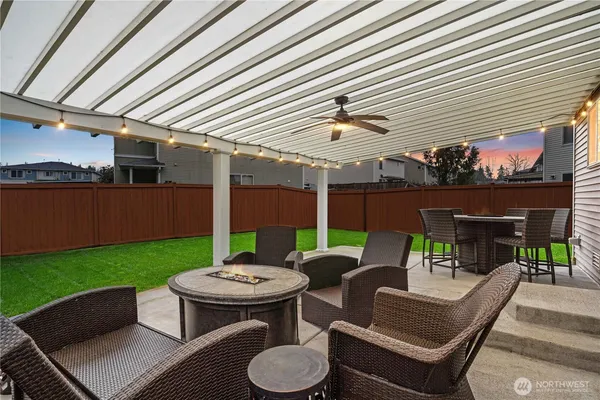 a balcony with furniture and a potted plant