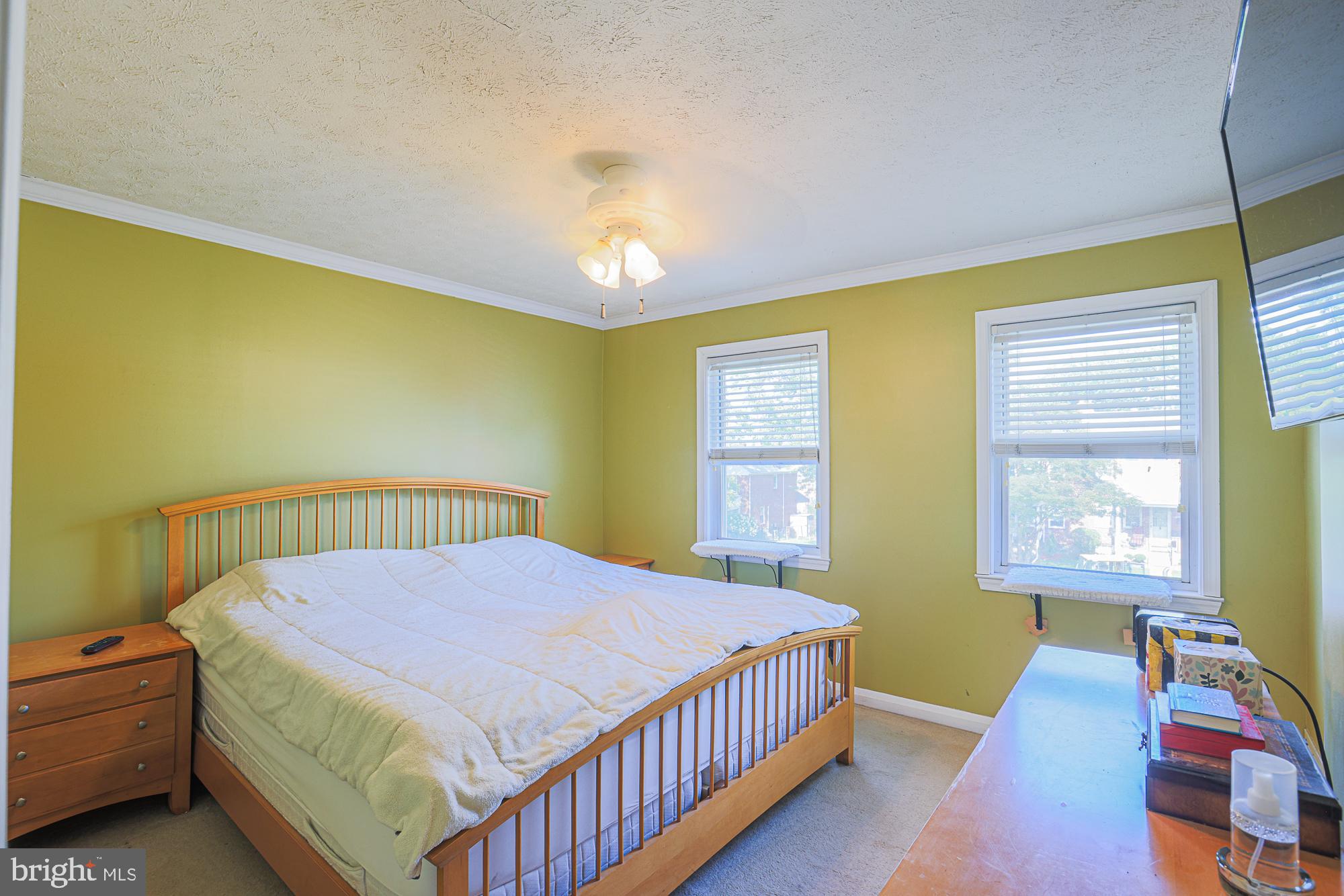 8343 Hillendale Road Baltimore, MD 21234 - Photo 18 of 35 a bedroom with a bed and a window