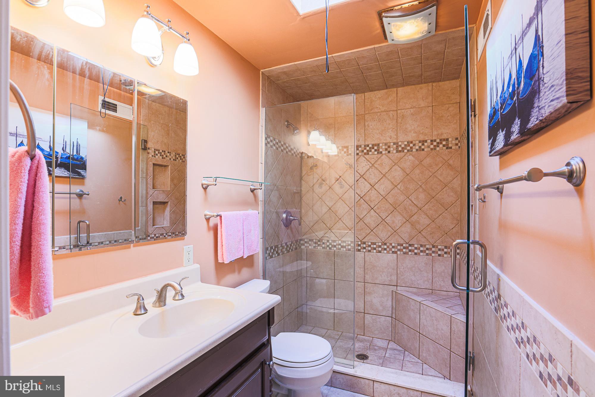 8343 Hillendale Road Baltimore, MD 21234 - Photo 23 of 35 a bathroom with a sink and a mirror