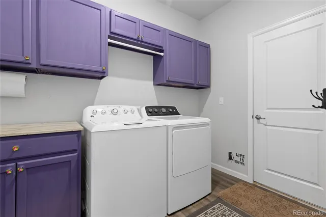 a media room with lots of chairs and a rug