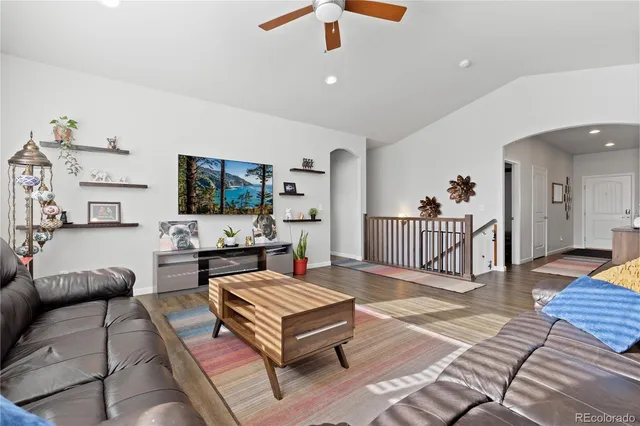 a living room with furniture or couch and a dining table