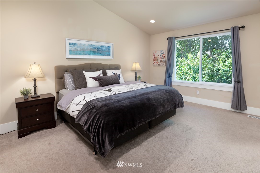 5204 Northeast 9th Place Renton, WA 98059 - Photo 17 of 33 a bedroom with a bed and a night stand