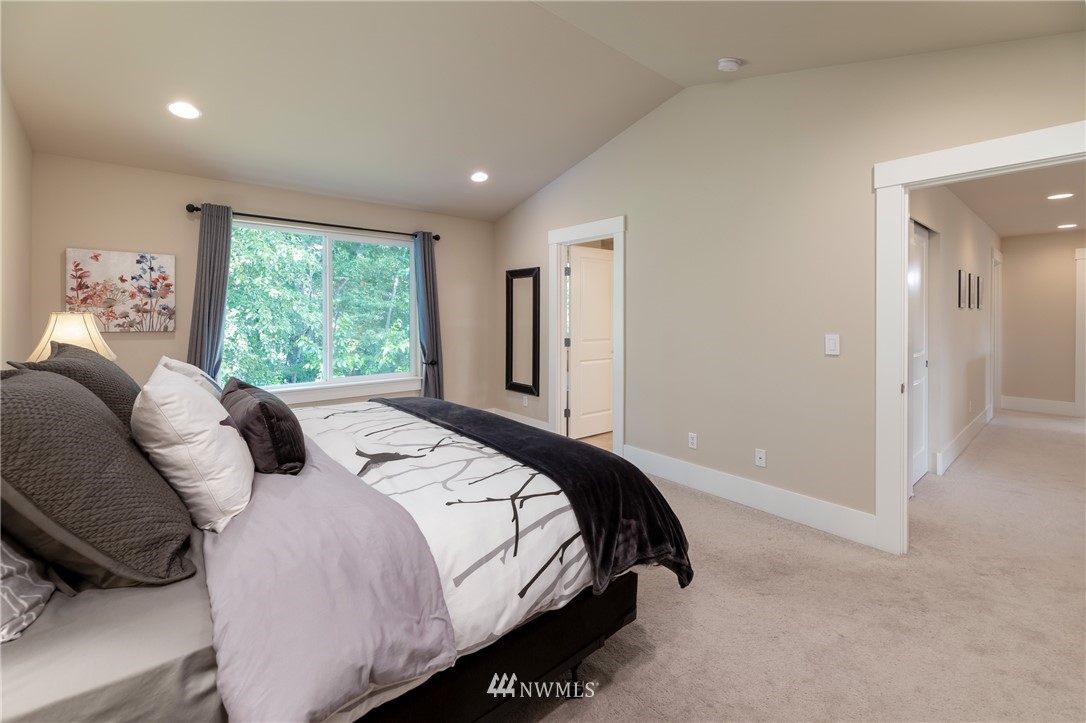 5204 Northeast 9th Place Renton, WA 98059 - Photo 19 of 33 a bedroom with a bed and a large window