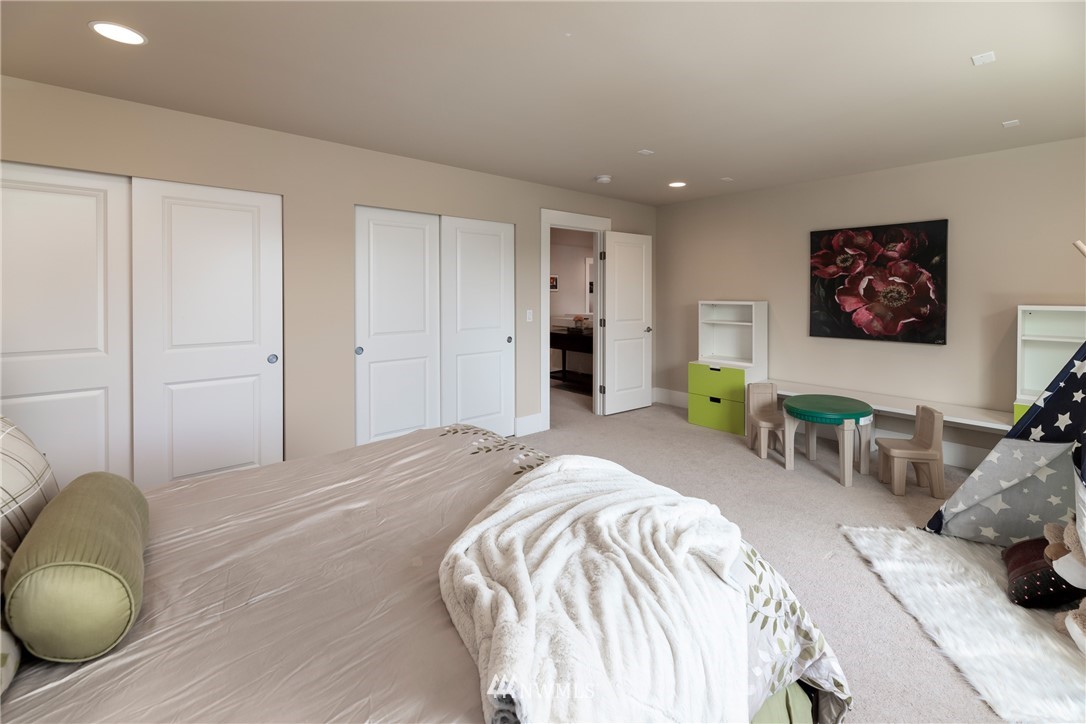 5204 Northeast 9th Place Renton, WA 98059 - Photo 24 of 33 a bedroom with a bed and furniture