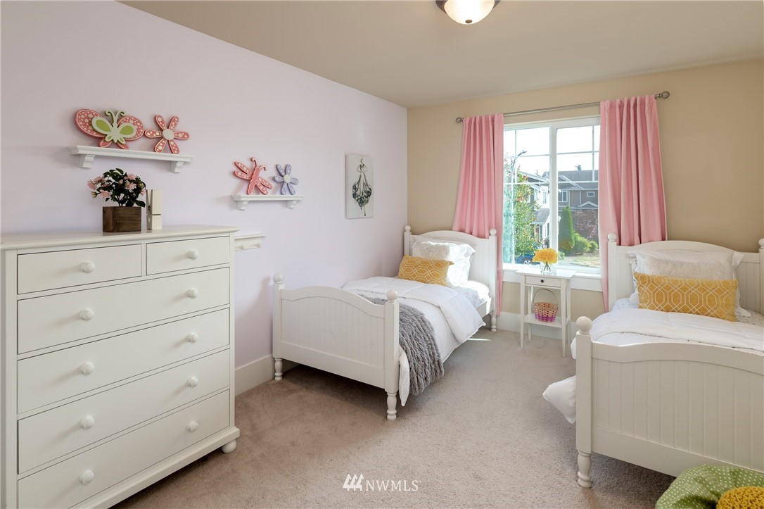 5204 Northeast 9th Place Renton, WA 98059 - Photo 26 of 33 a bedroom with a bed and a window