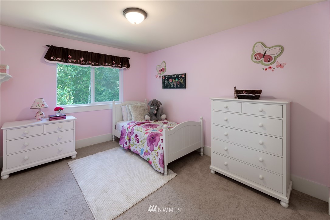 5204 Northeast 9th Place Renton, WA 98059 - Photo 28 of 33 a bedroom with a bed and a window