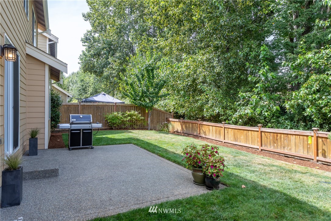 5204 Northeast 9th Place Renton, WA 98059 - Photo 32 of 33 a backyard of a house with table and chairs