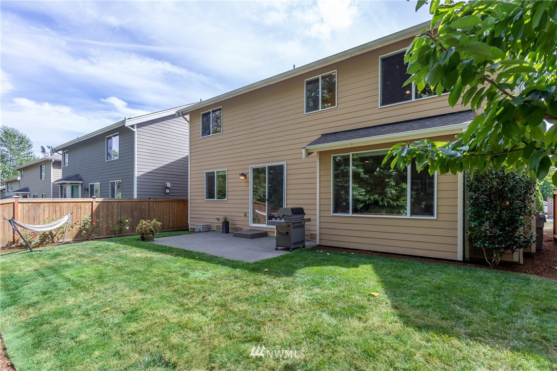 5204 Northeast 9th Place Renton, WA 98059 - Photo 33 of 33 a view of a house with a yard and sitting area