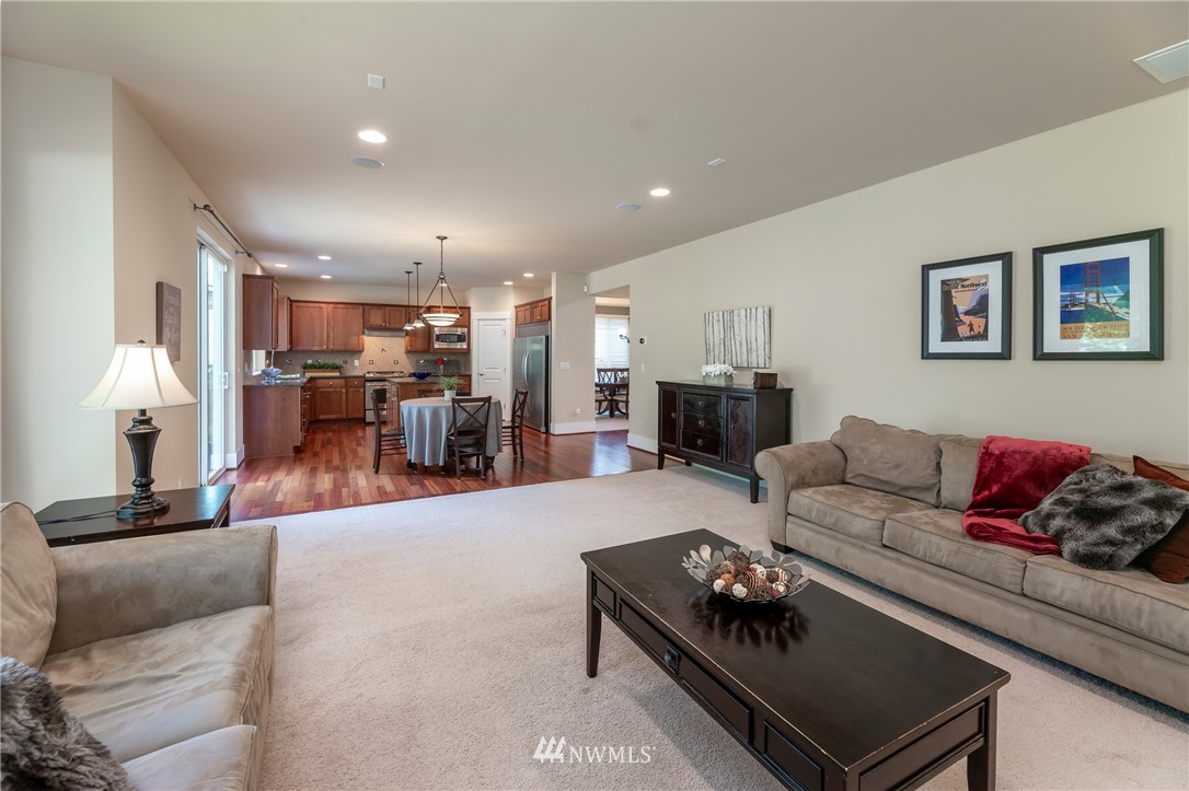 5204 Northeast 9th Place Renton, WA 98059 - Photo 7 of 33 a living room with furniture and kitchen view