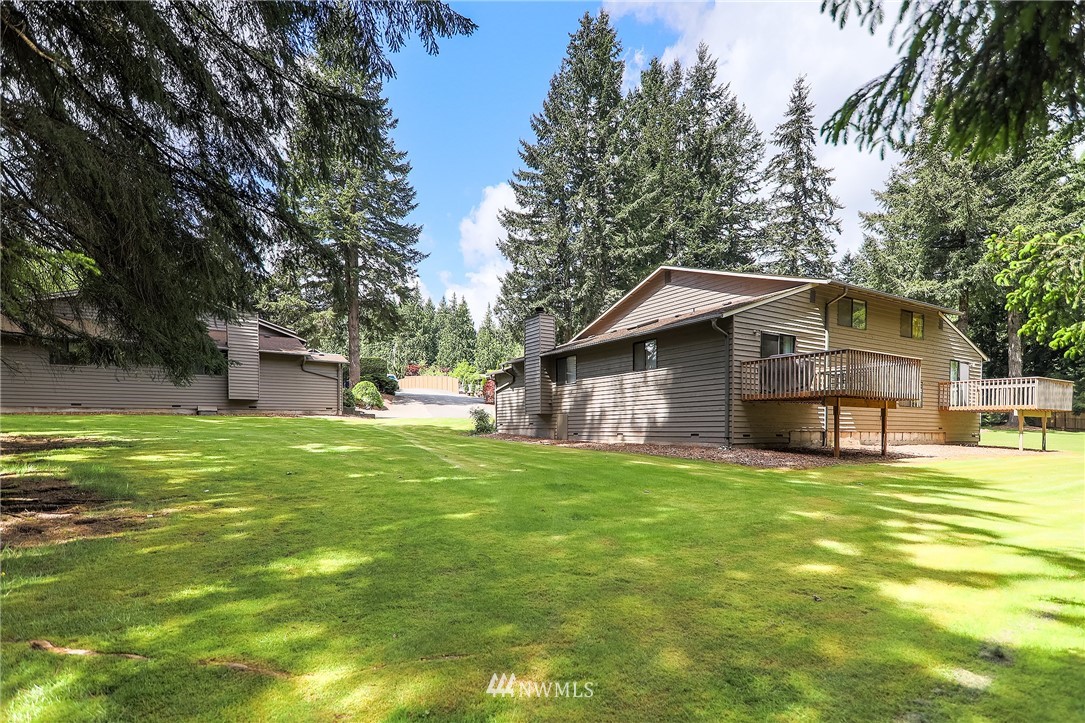 17215 Gravenstein Road Bothell, WA 98012 - Photo 13 of 13 a view of a house with a yard