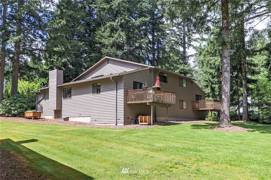 17215 Gravenstein Road Bothell, WA 98012 - Photo 5 of 13 a front view of house with yard and green space