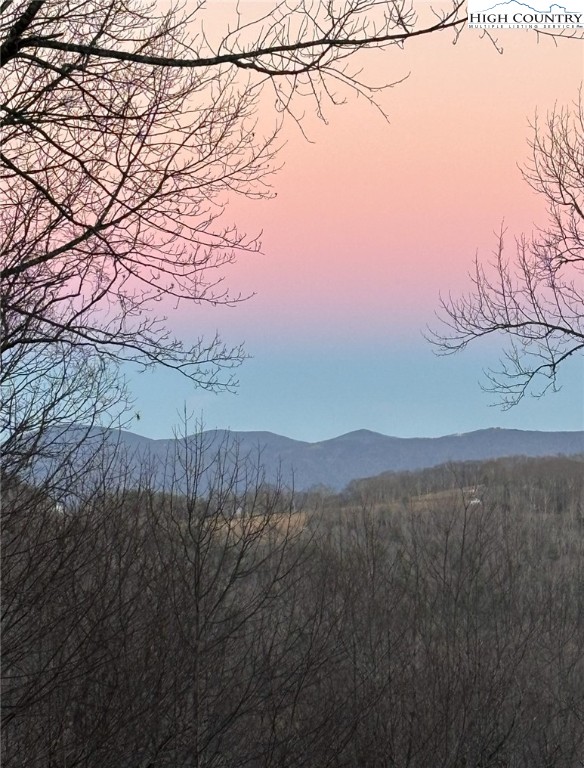 304 St Andrews Road Beech Mountain, NC 28604 - Photo 12 of 33 a view of mountain with sunset in background