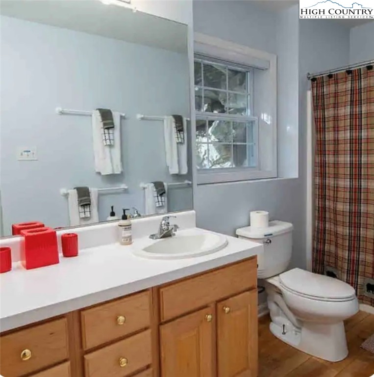 304 St Andrews Road Beech Mountain, NC 28604 - Photo 14 of 33 a bathroom with a sink toilet vanity and shower