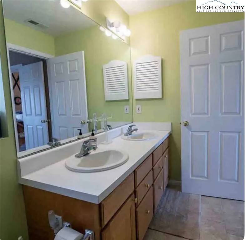 304 St Andrews Road Beech Mountain, NC 28604 - Photo 15 of 33 a bathroom with a sink and a mirror