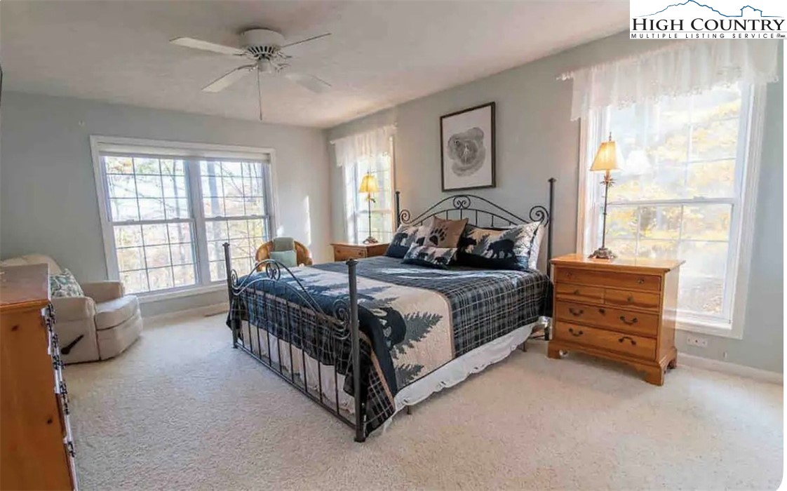 304 St Andrews Road Beech Mountain, NC 28604 - Photo 19 of 33 a bedroom with a bed and a window